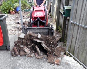 Brisbane Dingo Earthworks Pic 5 - Removing unwanted pavers that were concreted in