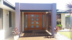 Warren Church Painting Pic 2 - Exterior rendered entry statement and Sikkins clear coating to double doors Morayfield