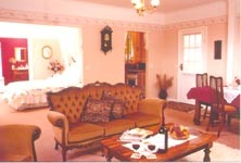 Cherry Garden Cottages Pic 1 - Cosy lounge room with open fire