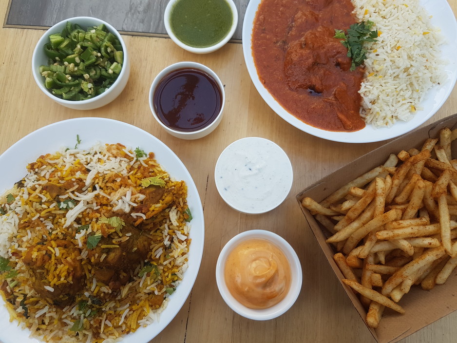 Chachu's Pic 1 - Authentic Chicken Biryani Butter Chicken and Rice Our Famous Spicy Fries Creamy sauce