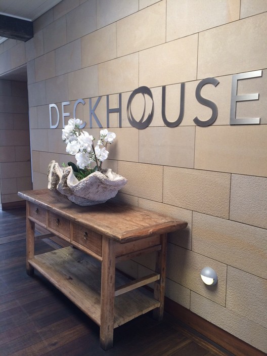 Deckhouse Pic 2 - Welcoming table in the hallway leads to the dining areas and bathrooms also glam