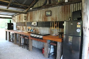 Silver Wattle Caravan Park Pic 5 - The Camp Kitchen fully equipped with pizza oven wood and gas fired BBQs TV Fridge