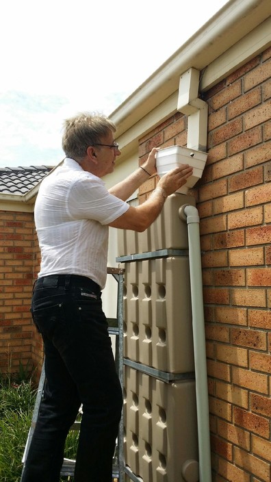 house-inspections Pic 2 - Rain head not secured with no screen to stop debris from gutters going into the water tank