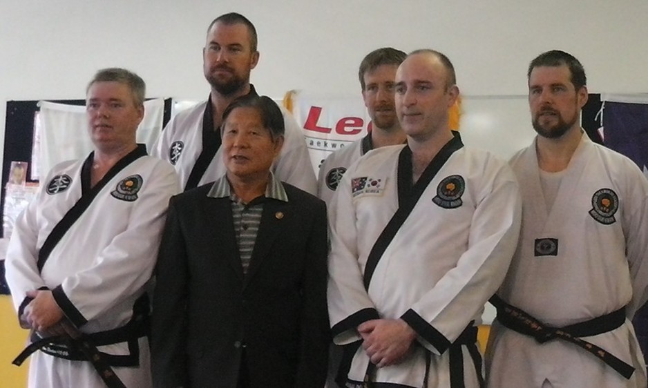 Lees Taekwondo Pic 1 - Grand Master Choon Bong Lee with Branch Instructor Ian Benton and Senior Black Belts and Seaview Downs Branch