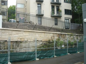 Strata Engineering Solutions Pic 3 - The retaining wall is fully remediated and tied securely into the bedrock without compromise to the original sandstone aesthetic