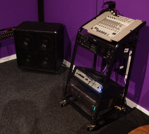 Backline Studios Pic 3 - On top is our eight channel mixer that supports four microphones piano keyboards aux inputs and instruments Underneath is our bass head and amplifier with 500 watts per channel feeding both four speaker bass and guitar cabinets