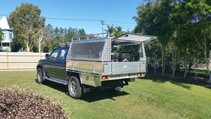 Affordable Custom Alloy Trays Pic 4 - Triton with checker plate and mesh canopy