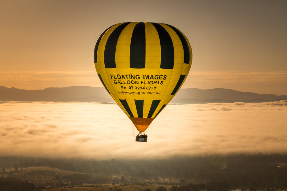 Floating Images Hot Air Balloon Flights Pic 1 - Gently floating over Brisbanes backyard with the fog