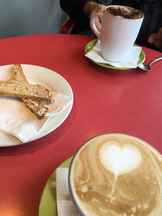 Fratellini Ristorante Pic 1 - Latte served in glasses and too hot to hold and drink Either need napkin wrap or serve it in a mug as ordered