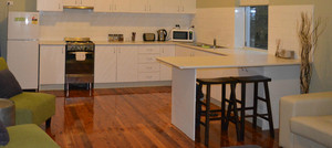 Revive Central Apartments Pic 2 - Luxury King 1 Bed Apartment Kitchen Living area