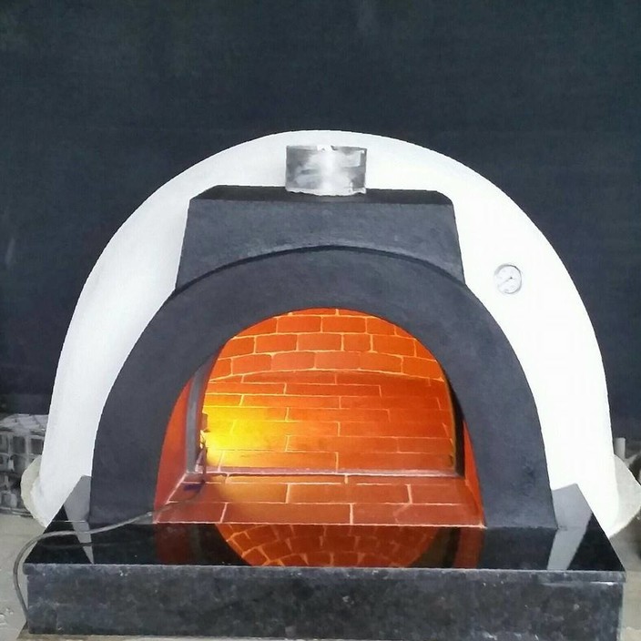 Melbourne Brick Ovens Pic 1 - 800 diameter With the flu inside the oven Smooth rendered finish outside with a beautiful blue stone bench to complete the look Ask about one today