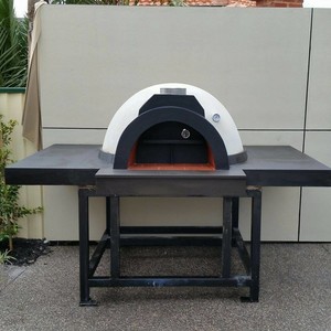 Melbourne Brick Ovens Pic 2 - This is an 800 diameter custom brick oven built on site It has extended 500mm tables on both sides finished off with a beautiful blue stone tile all the way round