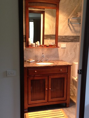 Tradeworks Pic 4 - A wooden vanity with a marble top