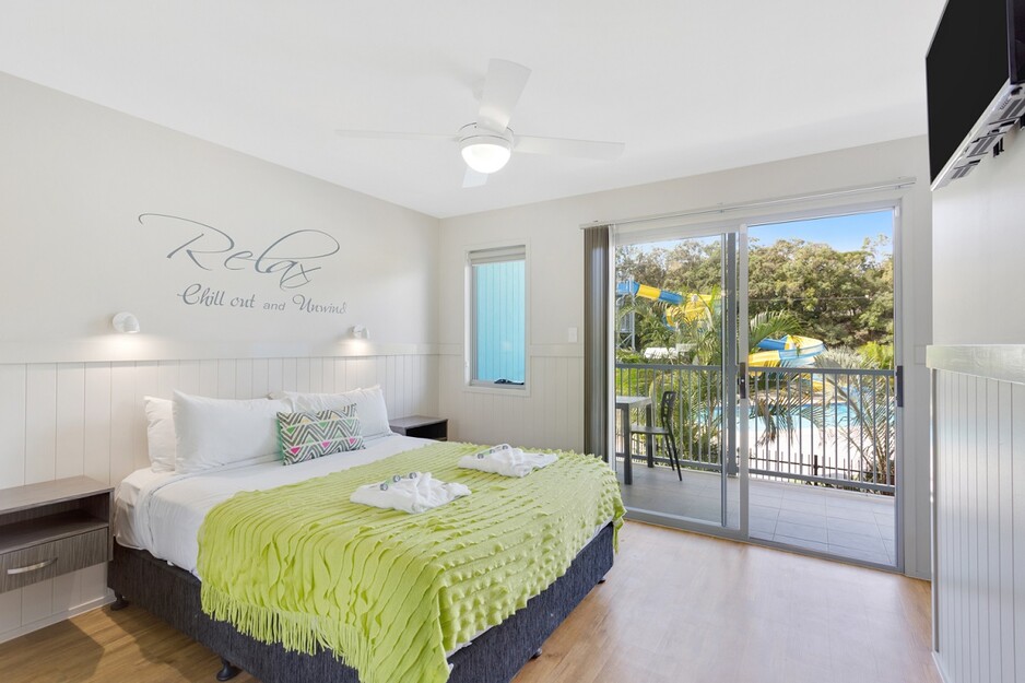 Nobby Beach Holiday Village Pic 1 - Relax in the Master Bedroom in one of four Poolside Penthouses