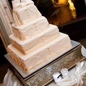 Brisbane Wedding Cakes Pic 5 - 4tier vintage look wedding cake with lacework and large fondant bow to reflect the gown worn by the bride