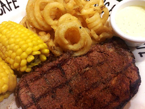 Hog's Breath Cafe Pic 4 - Blackened prime rib medrare with hog tail fries corn Bernaise sauce Good stuff