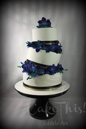 Cake This Pic 5 - Topsy turvy wedding cake with fresh royal blue Singapore Orchids