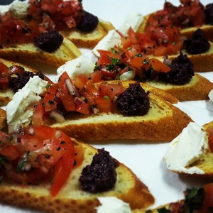 Delights Gourmet Food Pic 4 - Mini Bruschetta with Goats Cheese and Olive Tapenade Finger Food Menu