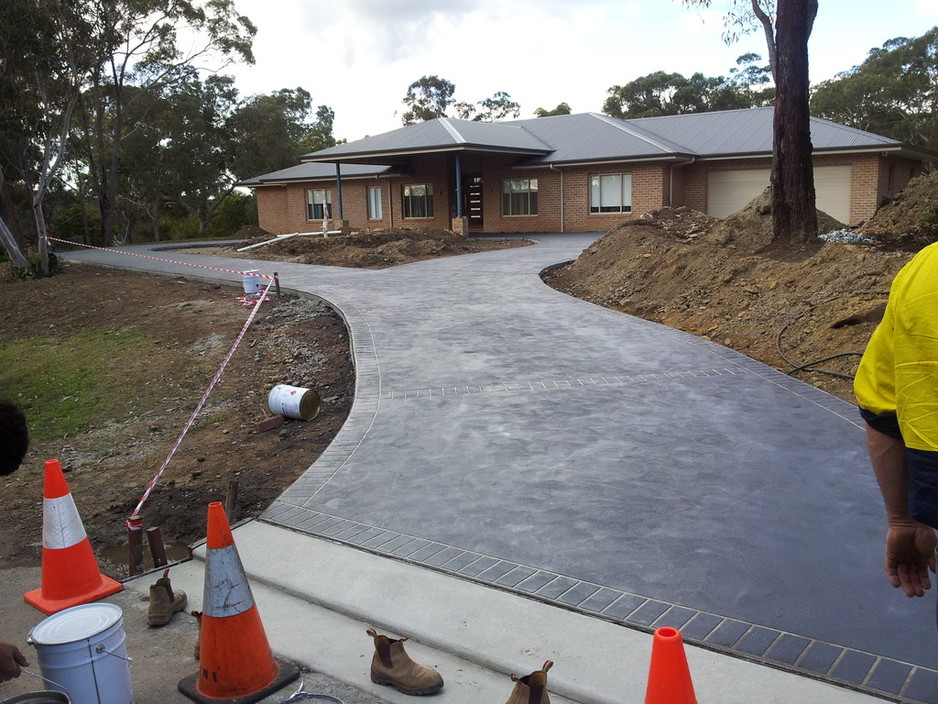 Choice Concrete Solutions Pic 1 - Colour cove finish with brick header stencil driveway