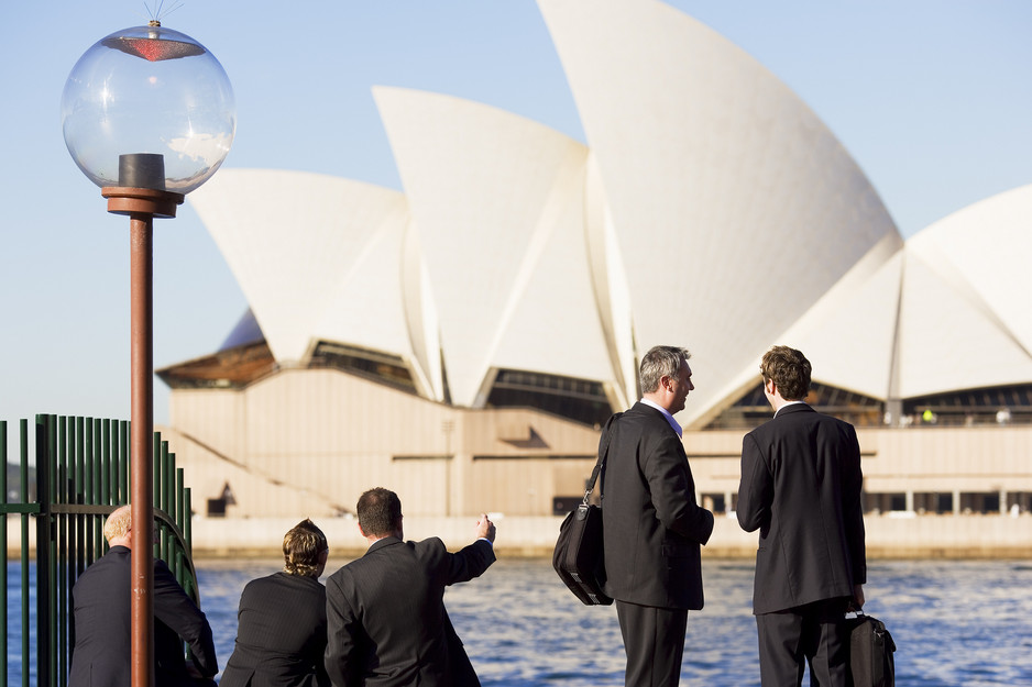 Business Events Sydney Pic 1 - three business men sitting two business men standing having a discussion with sydney opera house in background sydney