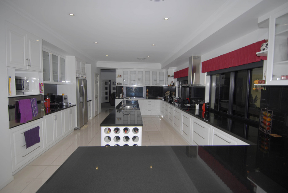 Dave Harris Cabinets Pic 1 - kitchen with 40mm granite tops and 2pac doors