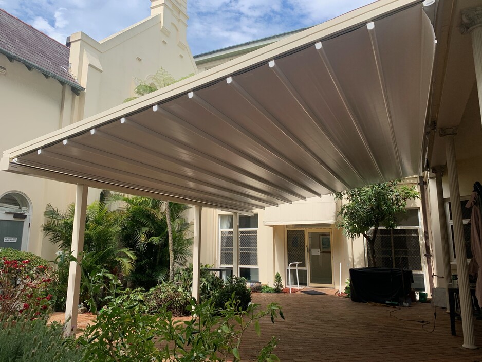 OZSUN SHADE SYSTEMS Pic 1 - Helioshade Allseasons Retractable Roof Aged Care Facility Randwick