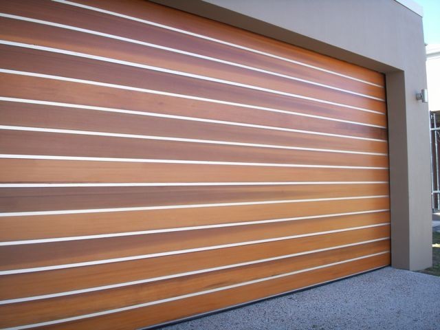 Allure Garage Doors Pty Ltd Pic 1 - Altache Cedar Garage Doors clear anodised strips between western red cedar