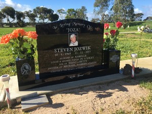 The Headstone Company Pic 4 - Black headstone base with emblems located at the Lara Cemetery