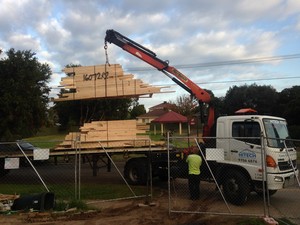 Hitech Trusses & Wall Frames Pty Ltd Pic 2 - Company Crane Truck unloading Roof Trusses