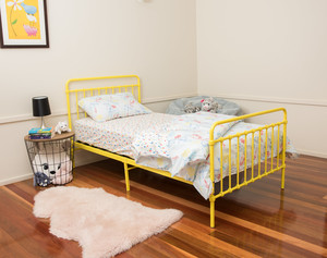 Gummybabies.com.au Pic 3 - The Akuna Metal Bed in vibrant yellow with Brolga Single Mattress and Umbrellas fitted sheet and quilt cover