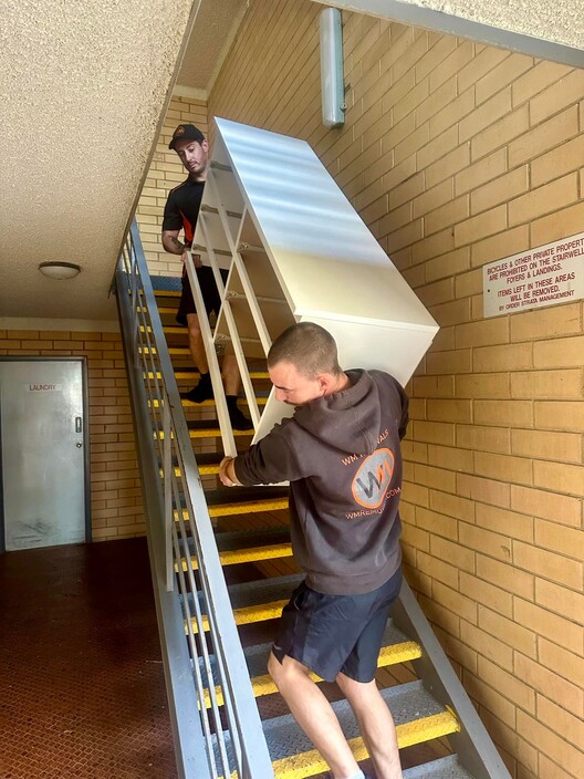 WM Removals & Storage Pic 1 - WM Removals Storage team moving furniture during a relocation in Adelaide