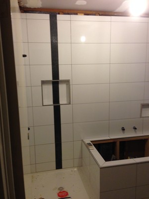 Handy Andy Cabinetry Pic 4 - Bathroom reno showing tiling before grout