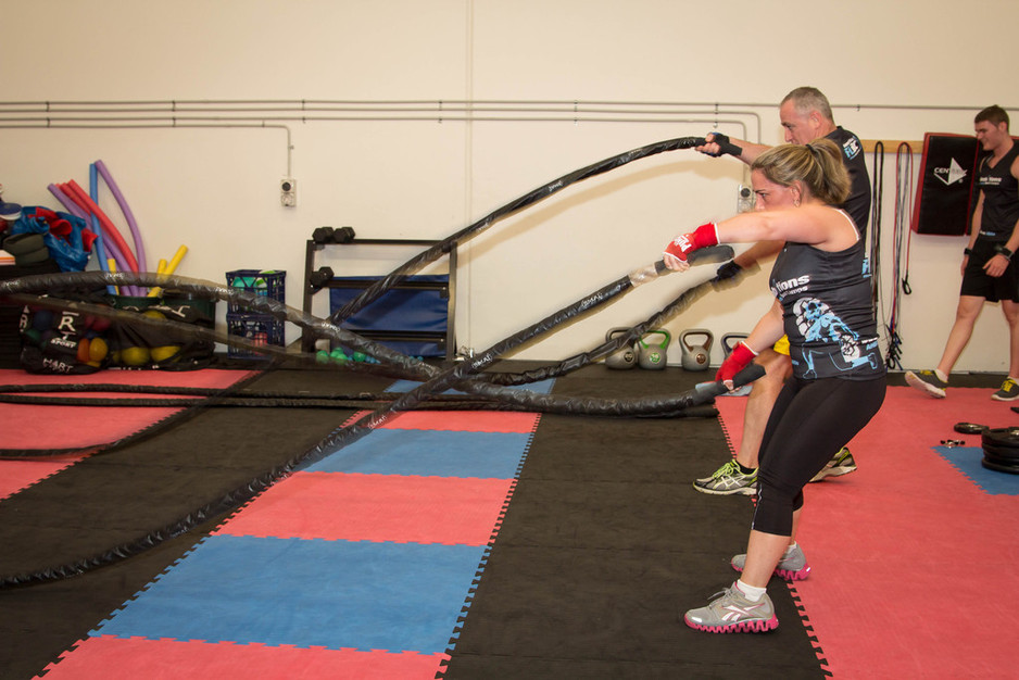 Ambitions Fit and Lean Boot Camps Pic 1 - Smashing it out on the battle ropes