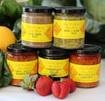 Dish & Spoon Fine Foods Pic 1 - Some of our pestos keeping company with our strawberry wattleseed jam on display at Indigiscapes Redfest display