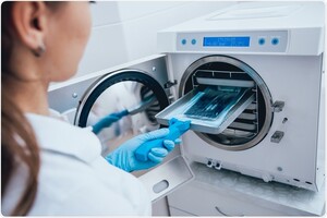 Autoclaves QLD Pic 2 - Dental autoclave being loaded with instruments for sterilisation cycle