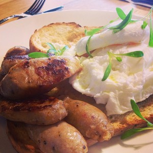 Reunion Cafe Dining Pic 5 - Perfectly poached eggs with pork and fennel sausage