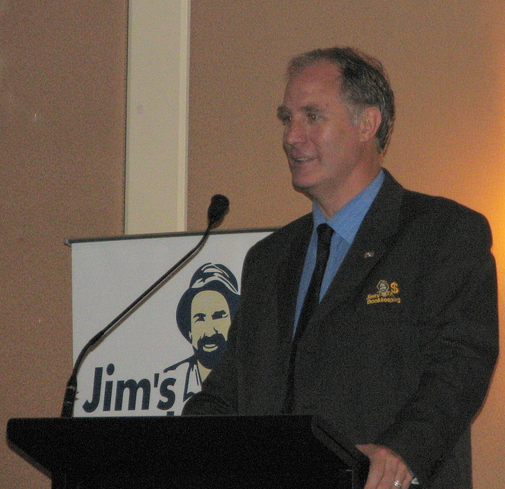 Jim's Bookkeeping Pic 1 - john at the podium