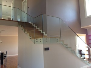 Ros Balustrade & Fencing Pic 3 - BAL3 12mm clear toughened glass side fixed to the wall via 25mm Patching system