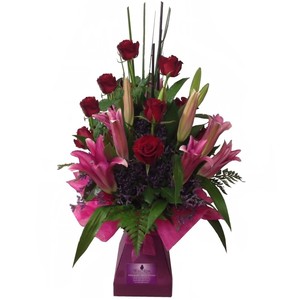 Wild Rose Florist Pic 4 - Sunset WRF86 Delightful long lasting Oriental Lilies with premium Roses Presenting in a complimentary vase box with ribbon bows and cellophane wrap