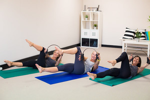 Art of Pilates Pic 5 - Our mat classes incorporate small props such as Pilates circles toning balls bands and more