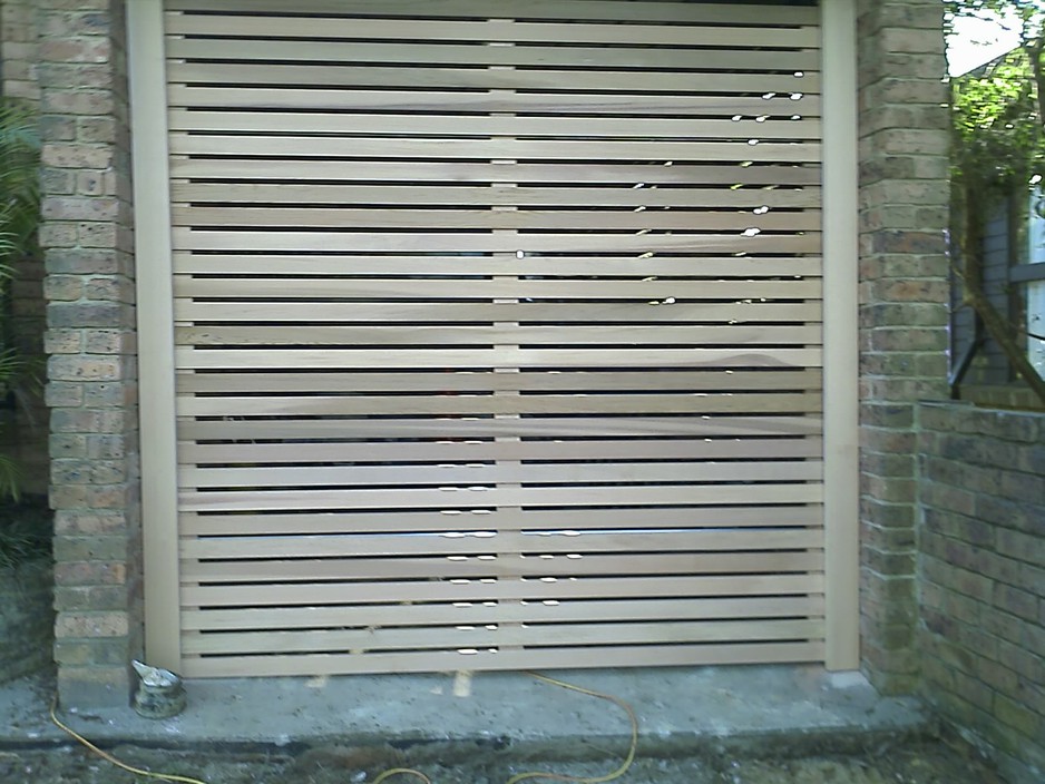 Rod's Doors & More Pic 2 - Cedar panel lift door