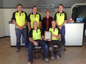 Cowra Plaster Works Pic 3 - Our team of tradesmen holding our 2013 CSR ILS Customer Service Award