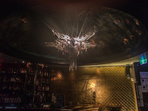 Lychee Lounge Pic 4 - Chandelier with peacock feathers and tassels