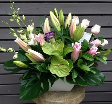 Narrabeen House Of Flowers Florists Pic 1 - Ceramic pot arrangement with pink oriental lilies pink roses Singapore orchids and antheriumsAdd a caption