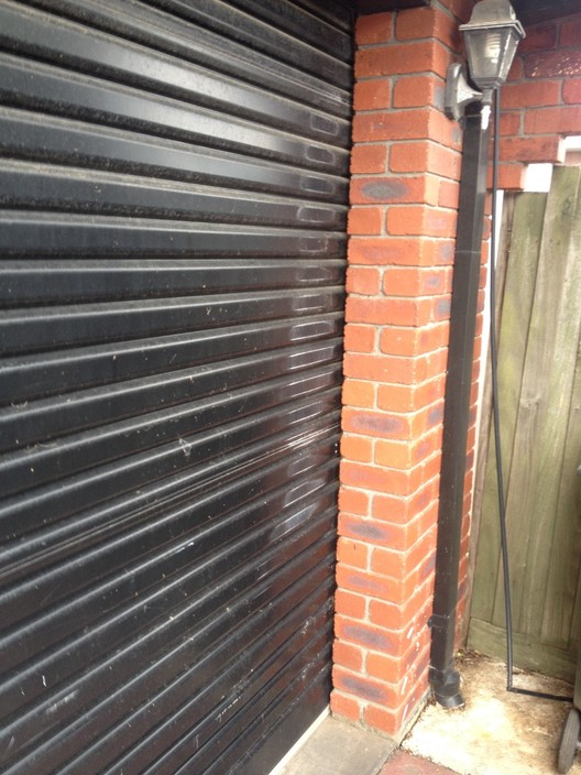 Lock N Secure Garage Doors Pic 1 - Damaged Roller Door