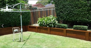 A-Z Property Maintenance Pic 4 - Fence retaining wall stained Hegdes gardens maintained