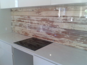 Sun City Glass and Screens Pic 3 - Clear glass splashback mounted to rustic timber backdrop