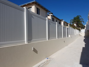 Probuild Technologies Pic 5 - PVC Privacy Fence on top of a Rendered Brick Wall