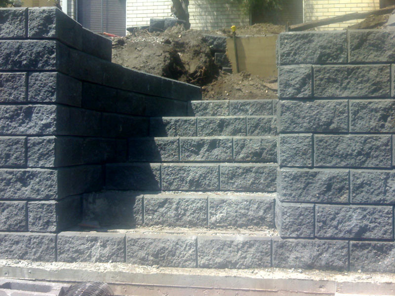 Flatstick Landscapes Pic 2 - stairway built into a retaining wall nearing completion