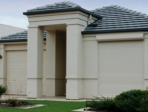 Low Cost Garage Doors & Gates Pic 5 - Automatic window roller shutters add cyclone protection security along with insulation